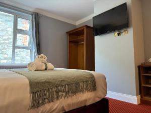 Giường trong phòng chung tại The Killarney Grand