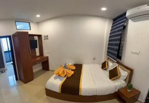 Voodi või voodid majutusasutuse Ayur Arogyam Rooms and Spa toas