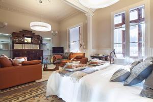 a large bedroom with a large bed with pillows on it at Barcino Inversions - Apartments in Rambla de Catalunya in Barcelona