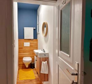 a bathroom with a white toilet and a sink at Grosse Wohnung in der Altstadt von Ettlingen in Ettlingen
