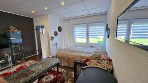 a bedroom with a bed and a tv in it at Orientalische Wohnung in Meckenheim