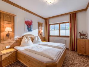 Łóżko lub łóżka w pokoju w obiekcie Appartements Haflingerhof