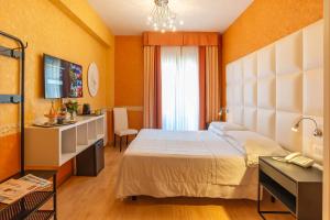 Postel nebo postele na pokoji v ubytování Hotel Jane