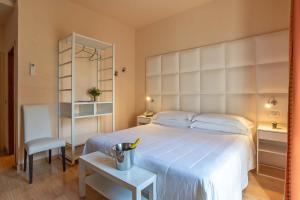 Postel nebo postele na pokoji v ubytování Hotel Jane