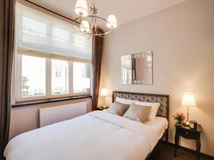 Posteľ alebo postele v izbe v ubytovaní Too-Good Apartments