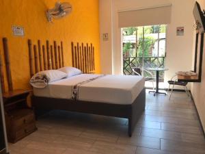 Postel nebo postele na pokoji v ubytování PH BOUTIQUE HOTEL Girardot