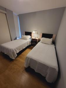 Ein Bett oder Betten in einem Zimmer der Unterkunft Departamento puerto Santa Fe