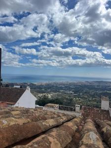 a view of the ocean from the roof of a building at ALMAFUERTE in Mijas