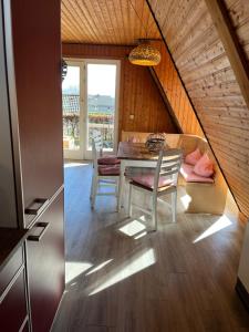 a kitchen and dining room with a table and chairs at Vennhütte in Monschau