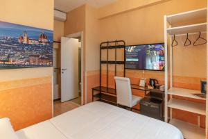 Postel nebo postele na pokoji v ubytování Hotel Jane