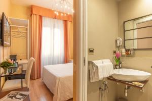 Postel nebo postele na pokoji v ubytování Hotel Jane