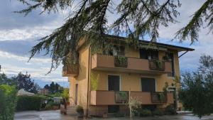 a building with balconies on the side of it at El Lugo apartment in Colà di Lazise