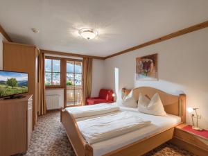 Łóżko lub łóżka w pokoju w obiekcie Appartements Haflingerhof