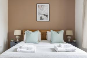 Llit o llits en una habitació de The Clapham Terraced House