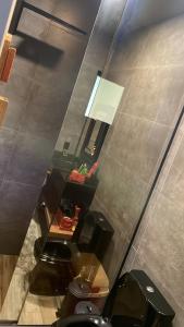 a view of a bathroom with two toilets and a window at Refúgio nascer das águas in Gravatal