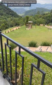 a view of the park from the balcony of a house at Refúgio nascer das águas in Gravatal