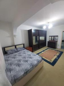 a bedroom with a large bed and a rug at Yola hime in Istanbul