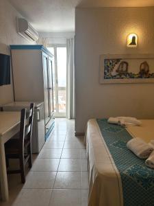 Postel nebo postele na pokoji v ubytování Hotel Canne al Vento