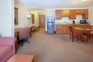 a room with a kitchen and a living room at Holiday Inn Express & Suites - Laredo-Event Center Area, an IHG Hotel in Laredo