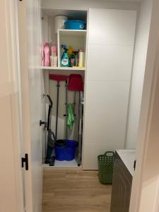 a kitchen pantry with a door open to a pantry with at LAR DE SEFA in Redondela