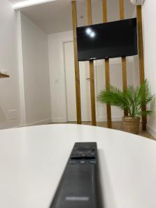 a room with a white counter top with a television at LAR DE SEFA in Redondela