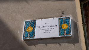 a sign on the side of a wall at Mazzini 81 - Ravenna Apartments in Ravenna