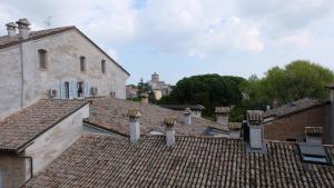 a view of roofs of buildings in a city at Mazzini 81 - Ravenna Apartments in Ravenna