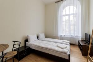 Postel nebo postele na pokoji v ubytování Soborniy Hostel