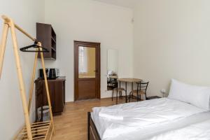Postel nebo postele na pokoji v ubytování Soborniy Hostel