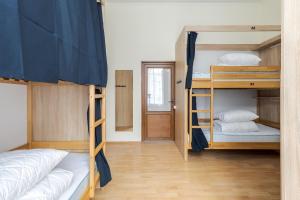 Postel nebo postele na pokoji v ubytování Soborniy Hostel