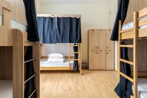 Postel nebo postele na pokoji v ubytování Soborniy Hostel
