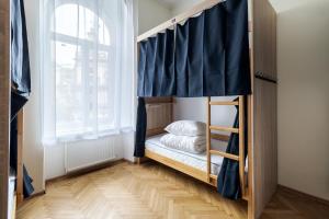 Postel nebo postele na pokoji v ubytování Soborniy Hostel