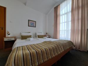 Una cama o camas en una habitación de Hotel Marica