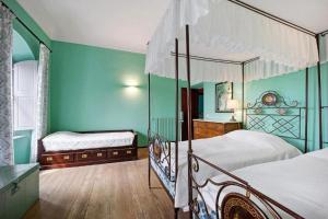 Кровать или кровати в номере La Vignetta Villa con giardino