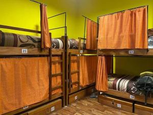 a group of bunk beds in a room at SAINT PETER'S LLAMA HOSTAL in La Paz