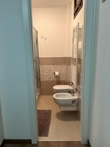 a bathroom with a toilet and a sink at Stanze Borgo Antico in Montenero di Bisaccia