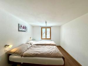 Postel nebo postele na pokoji v ubytování Haus Chalet Arnika