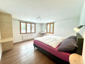 Postel nebo postele na pokoji v ubytování Haus Chalet Arnika