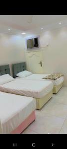 Ein Bett oder Betten in einem Zimmer der Unterkunft شالية مون لايت