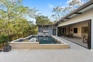 a pool on the back of a house at Brand-New 6BD Giant with Private Pool by SPCR in Potrero