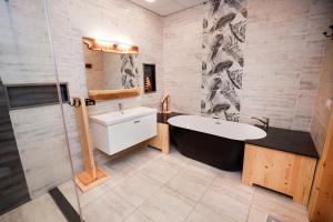 a bathroom with a bath tub and a sink at NEOM DAHAB - - - - - - - - - - - Your new hotel in Dahab with private beach in Dahab