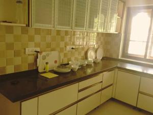 Kuhinja oz. manjša kuhinja v nastanitvi Anjilickal house, Entire private luxury villa
