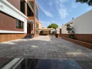 an empty courtyard of a house with a building at Villa Ajaman in Ajman 