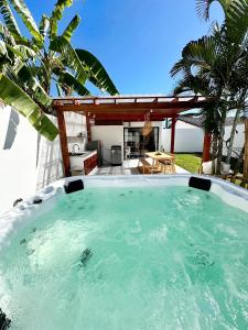 a hot tub in the backyard of a house at 2BR BIG JACUZZI VILLA & Garden - Bali style by La perla Phuket Rawai in Ban Saiyuan (1)