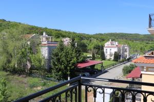 a view of a town from a balcony at Lilia Apartments Каваци, Созопол in Sozopol