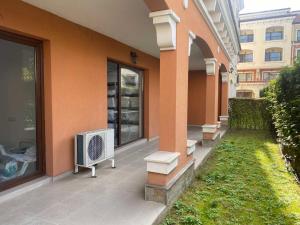 a house with an air conditioner sitting outside of it at Lilia Apartments Каваци, Созопол in Sozopol