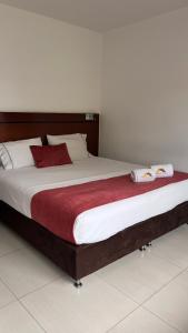 Postel nebo postele na pokoji v ubytování Hotel Dorado Gold + 21 fotografií