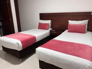 Postel nebo postele na pokoji v ubytování Hotel Dorado Gold