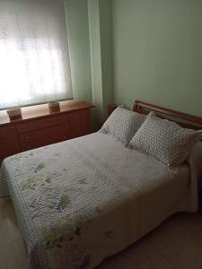 a bedroom with a bed and two windows at Apartamento en Magic World. Nueva Marina Dor in Oropesa del Mar +23 photos