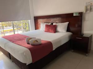 Postel nebo postele na pokoji v ubytování Hotel Dorado Gold